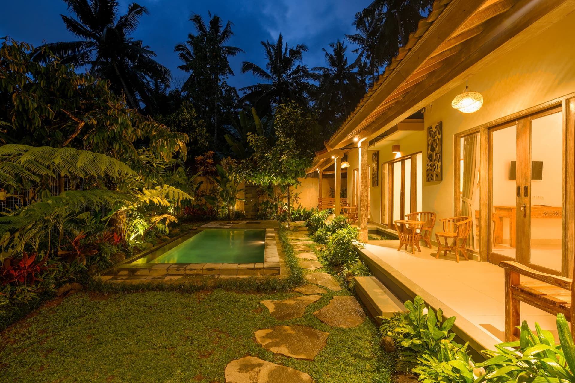 Garden lounge area with tropical greenery in Ubud villa