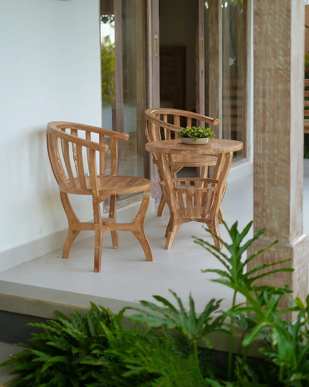 Evening exterior view of private villa with warm lighting in Ubud